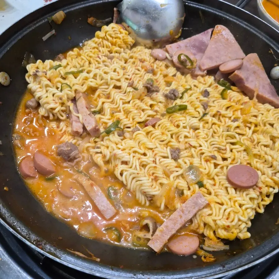A spoonful of Cheongwon budae-jjigae eaten with rice