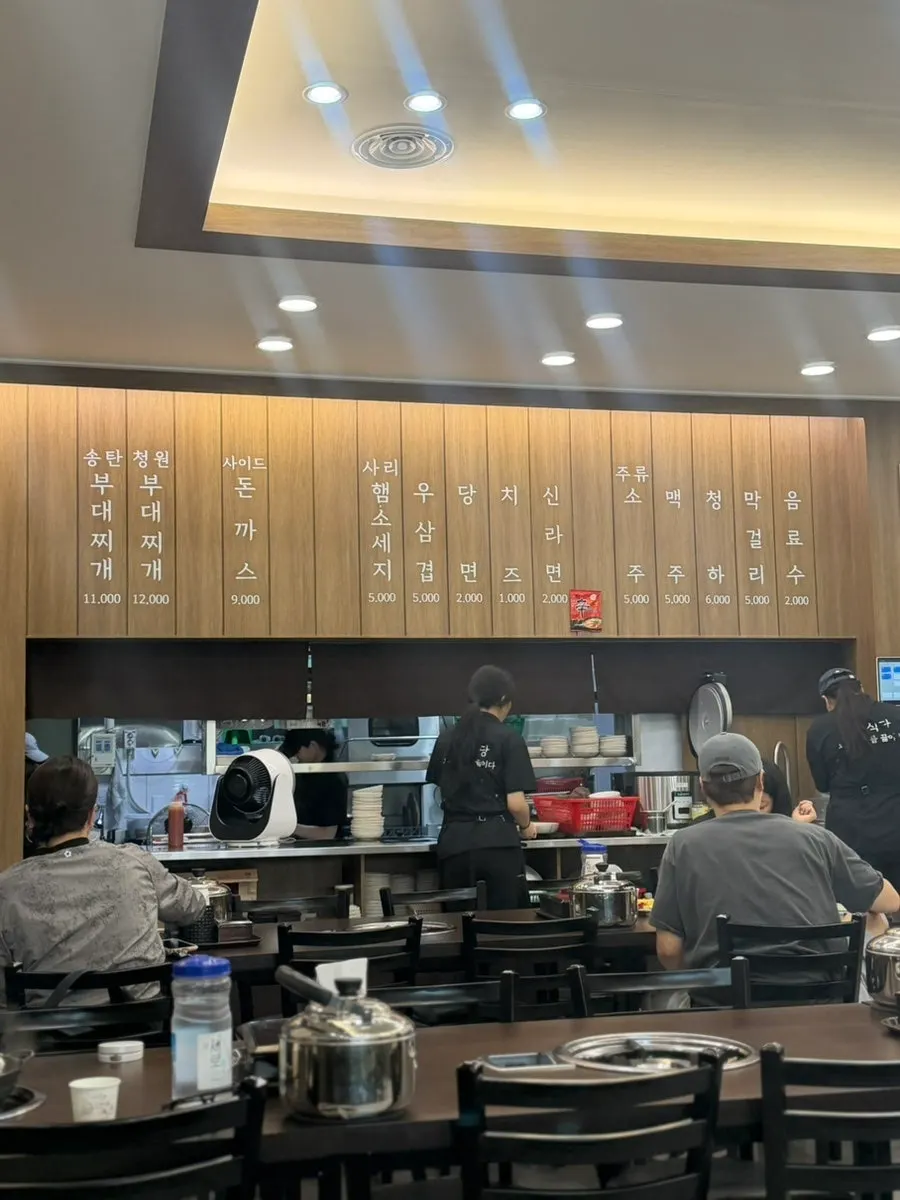 Interior of the open-kitchen restaurant with a view into the cooking area