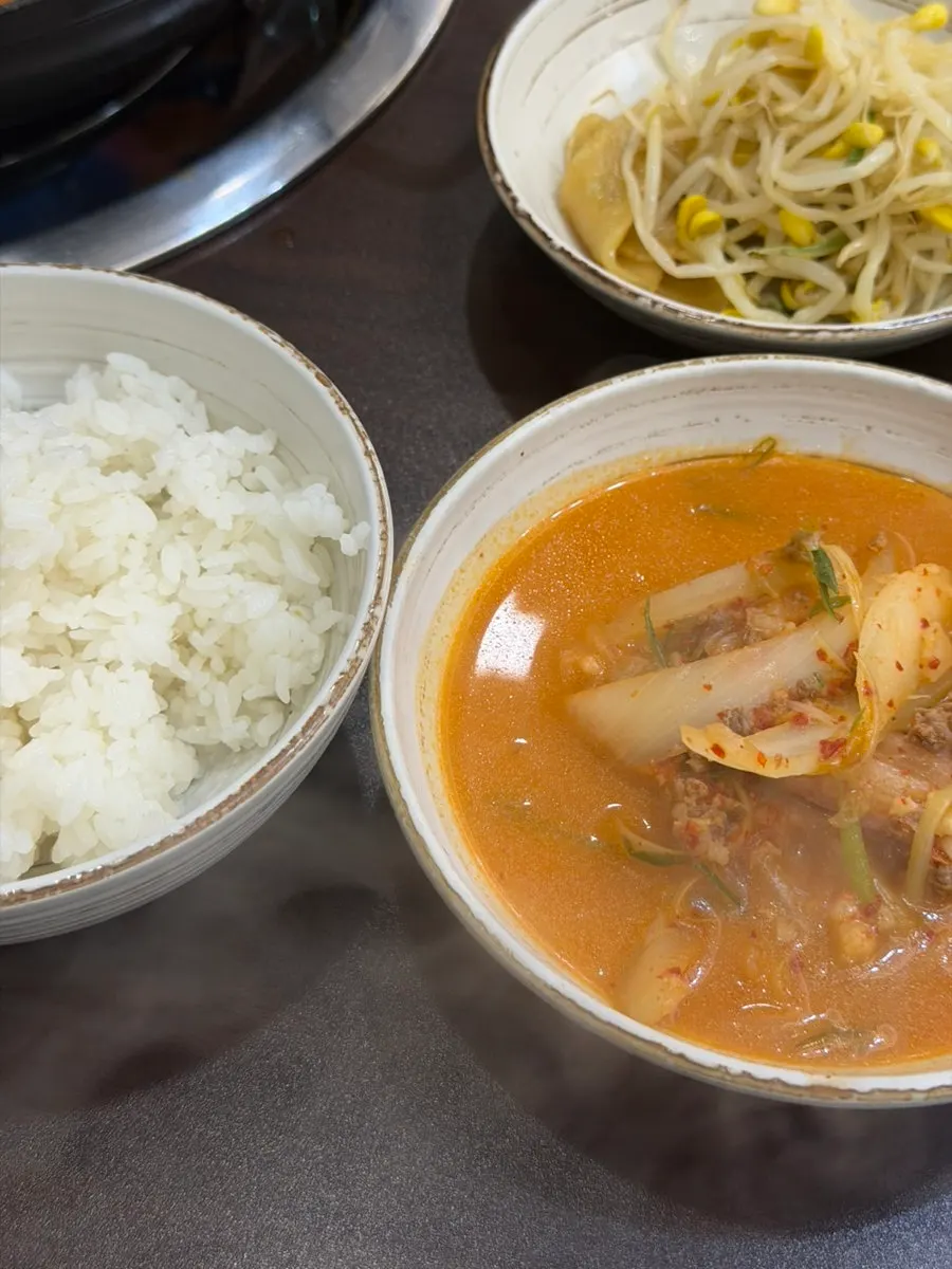 A table spread of budae-jjigae shared with parents