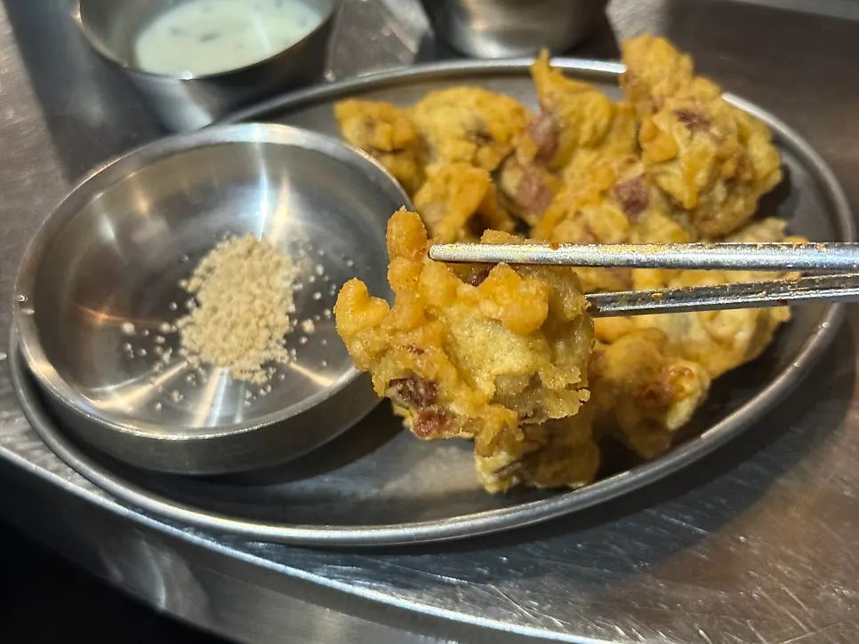 Snacking on fried gizzards while waiting for the chicken galbi