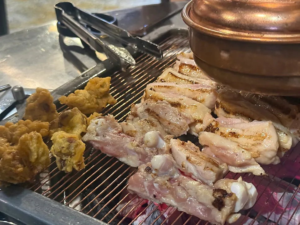 Chicken galbi grilling over charcoal