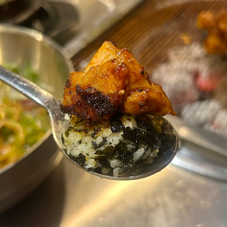 Charcoal chicken galbi piled on top of a rice ball