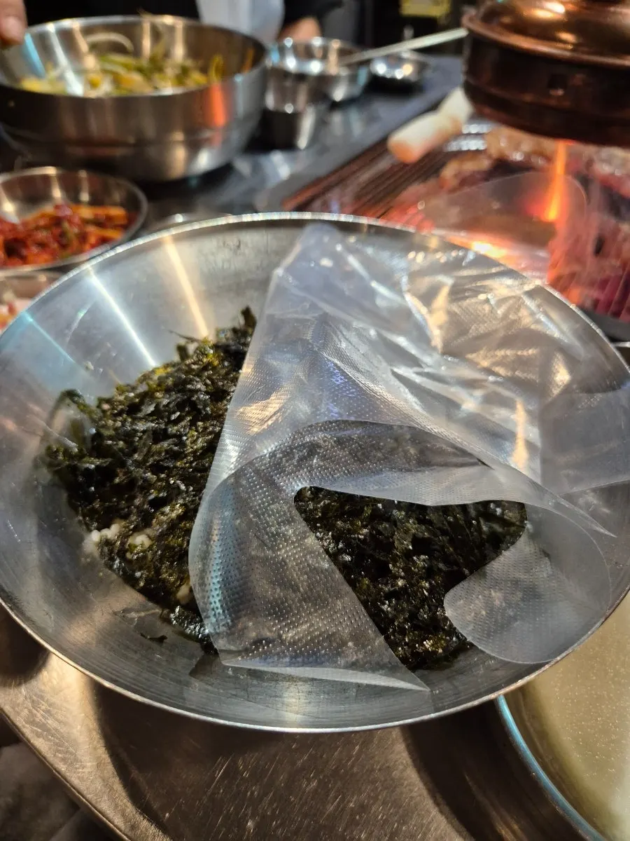 Chicken galbi grilling over charcoal