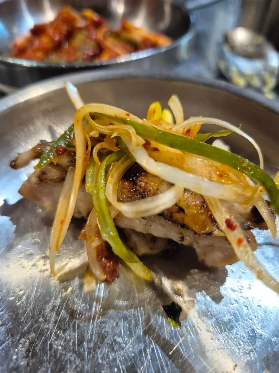Chicken galbi wrapped with shredded scallions