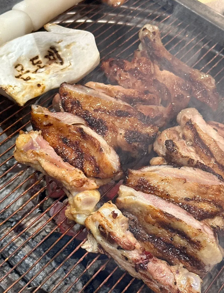 Garlic-salt and soy-marinated dakgalbi over charcoal