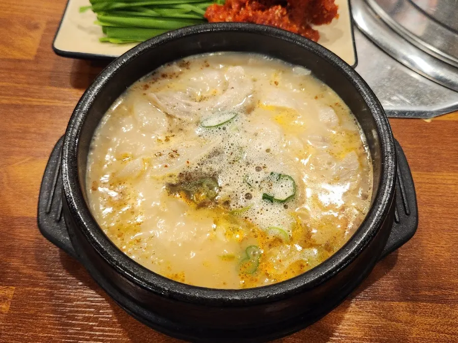Hangjeongsal boiled-pork gukbap in a hot earthenware bowl