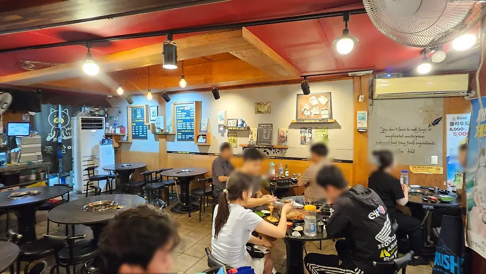 Interior of the jjukkumi restaurant with menu boards