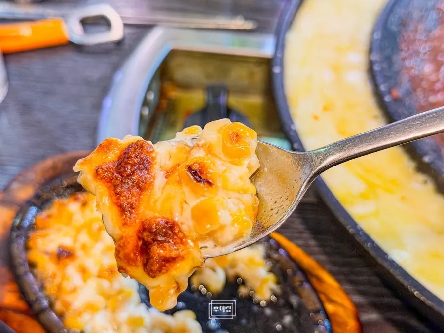 Close-up of stretchy melted corn cheese