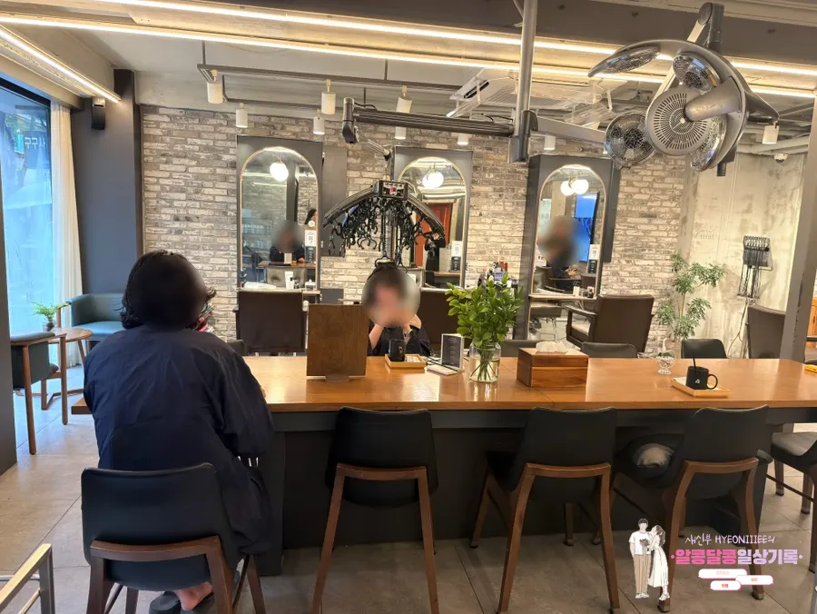 Wide view of the waiting area inside the salon