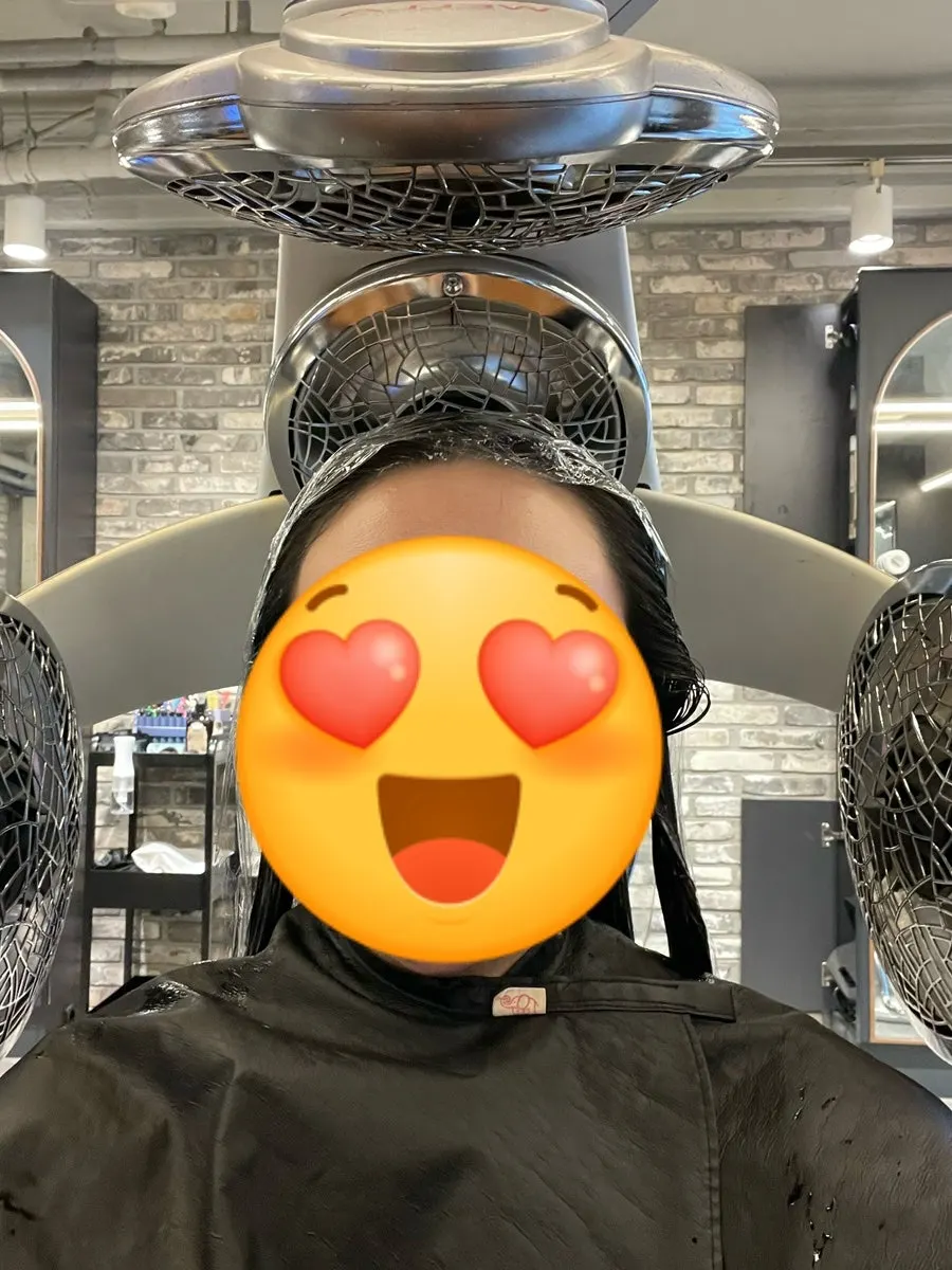 Layered perm treatment in progress