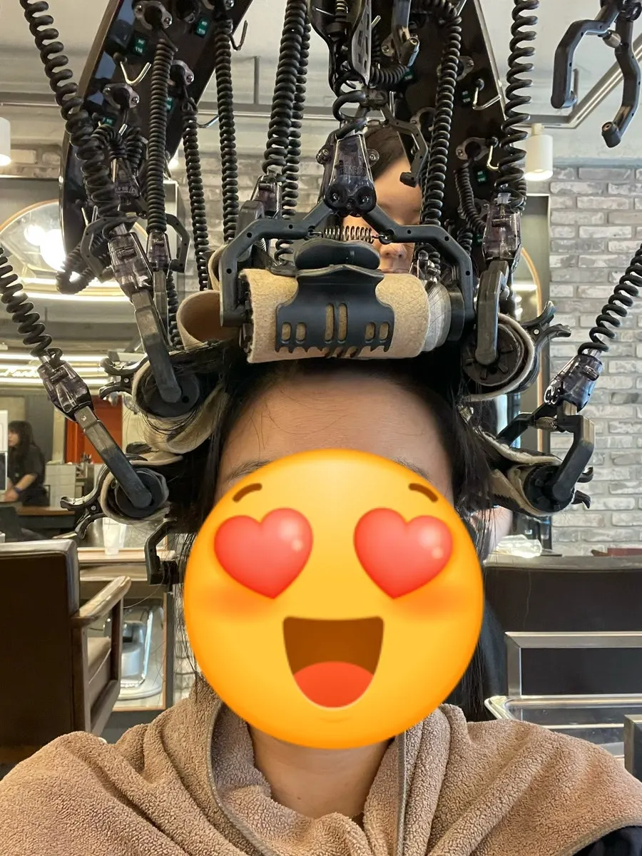 Fringe perm rolled up during the treatment