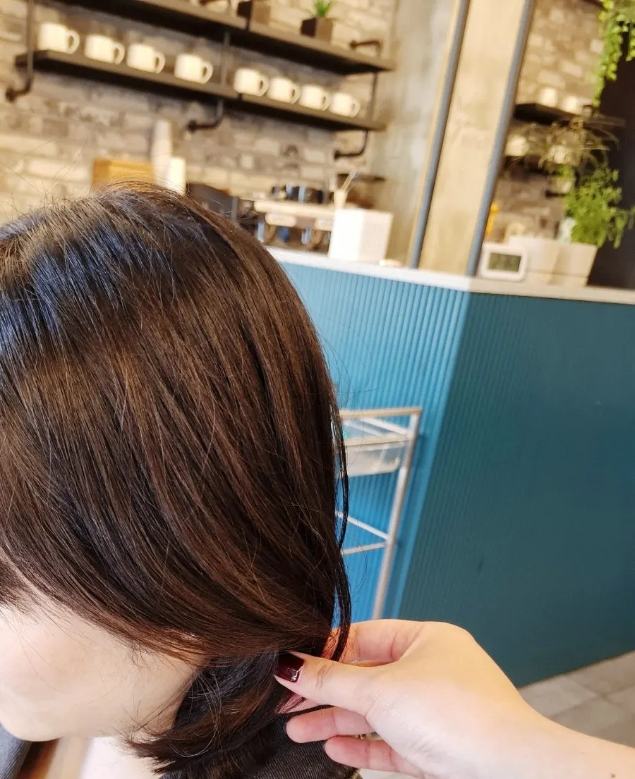 Back view of the swishy long hair after the cut