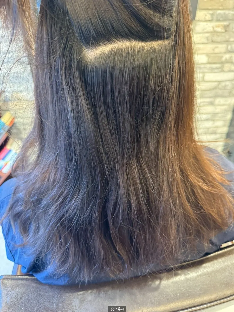 Lifted-up view of curly roots before treatment