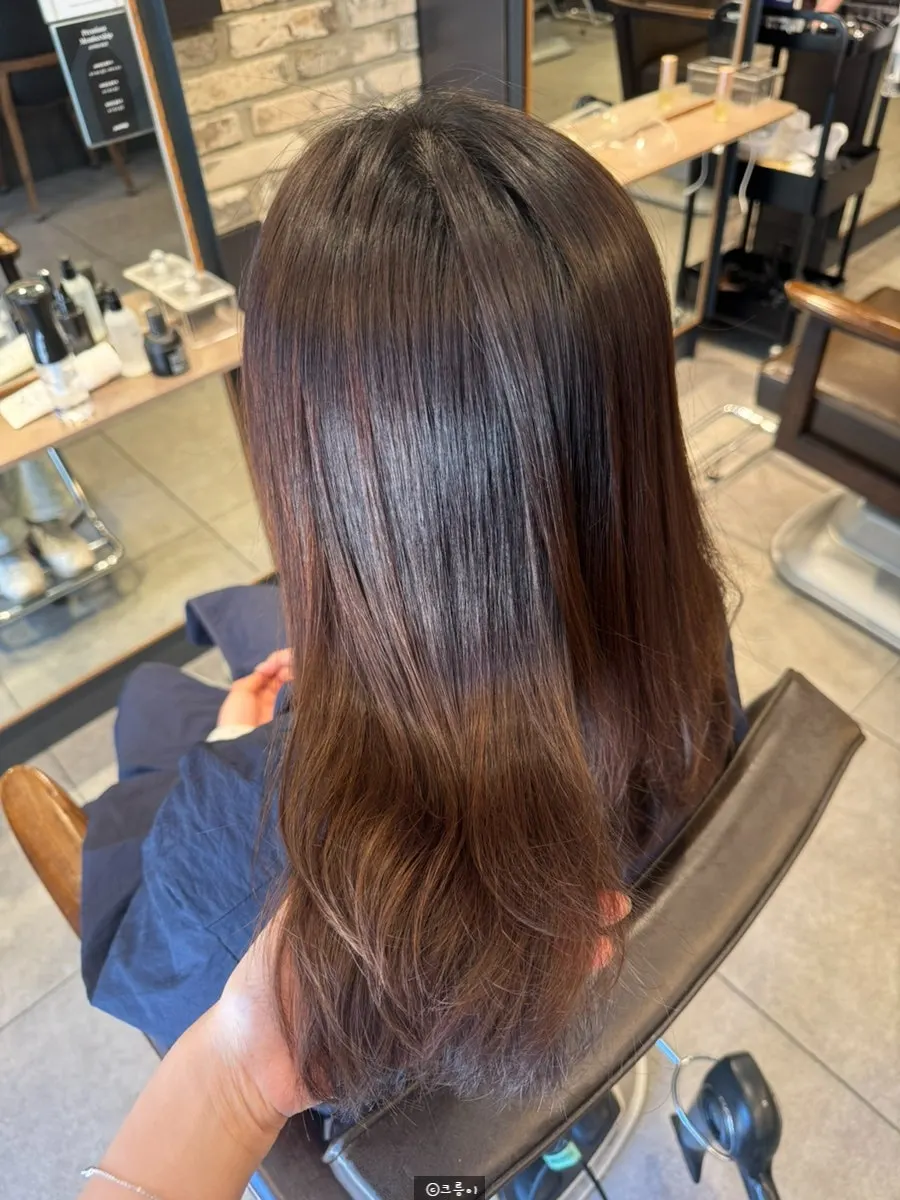 Side view showing the shiny straightened result