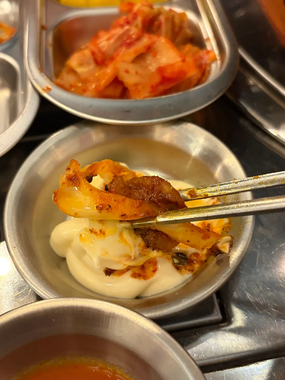 Vinegared gochujang sauce served with the makchang