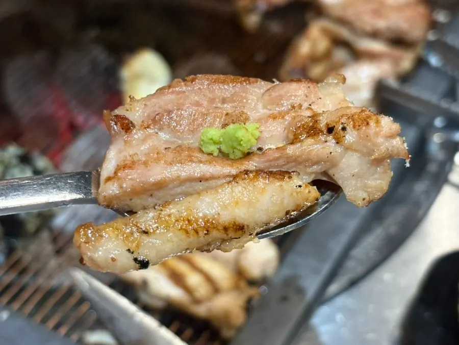 Chicken galbi wrapped with pickled radish and scallion salad