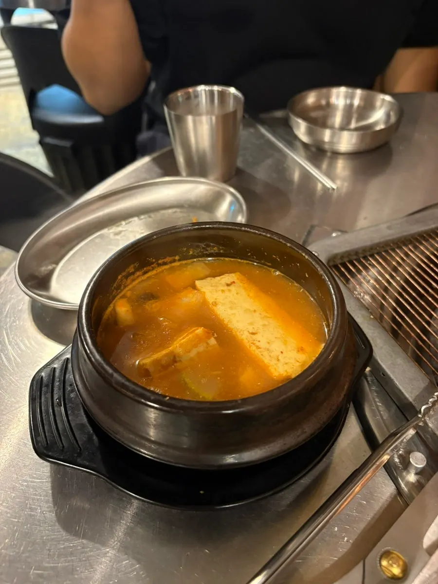 Complimentary chicken gizzards and doenjang stew