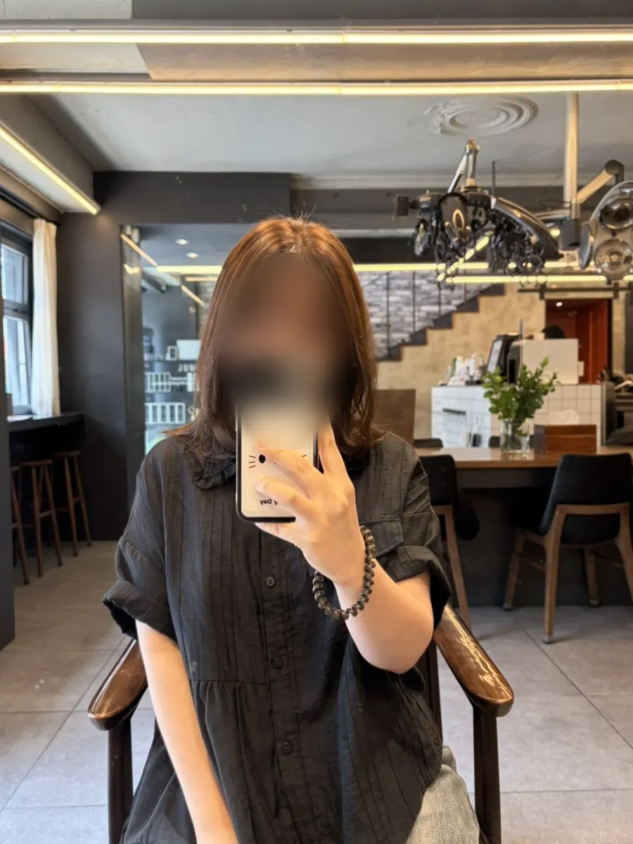 Result of toned-down ash brown hair color
