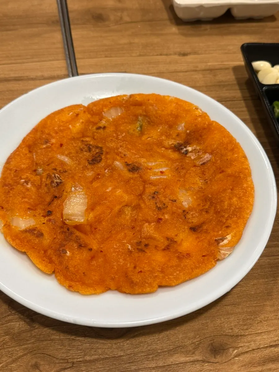 A generously sized kimchi pancake side dish