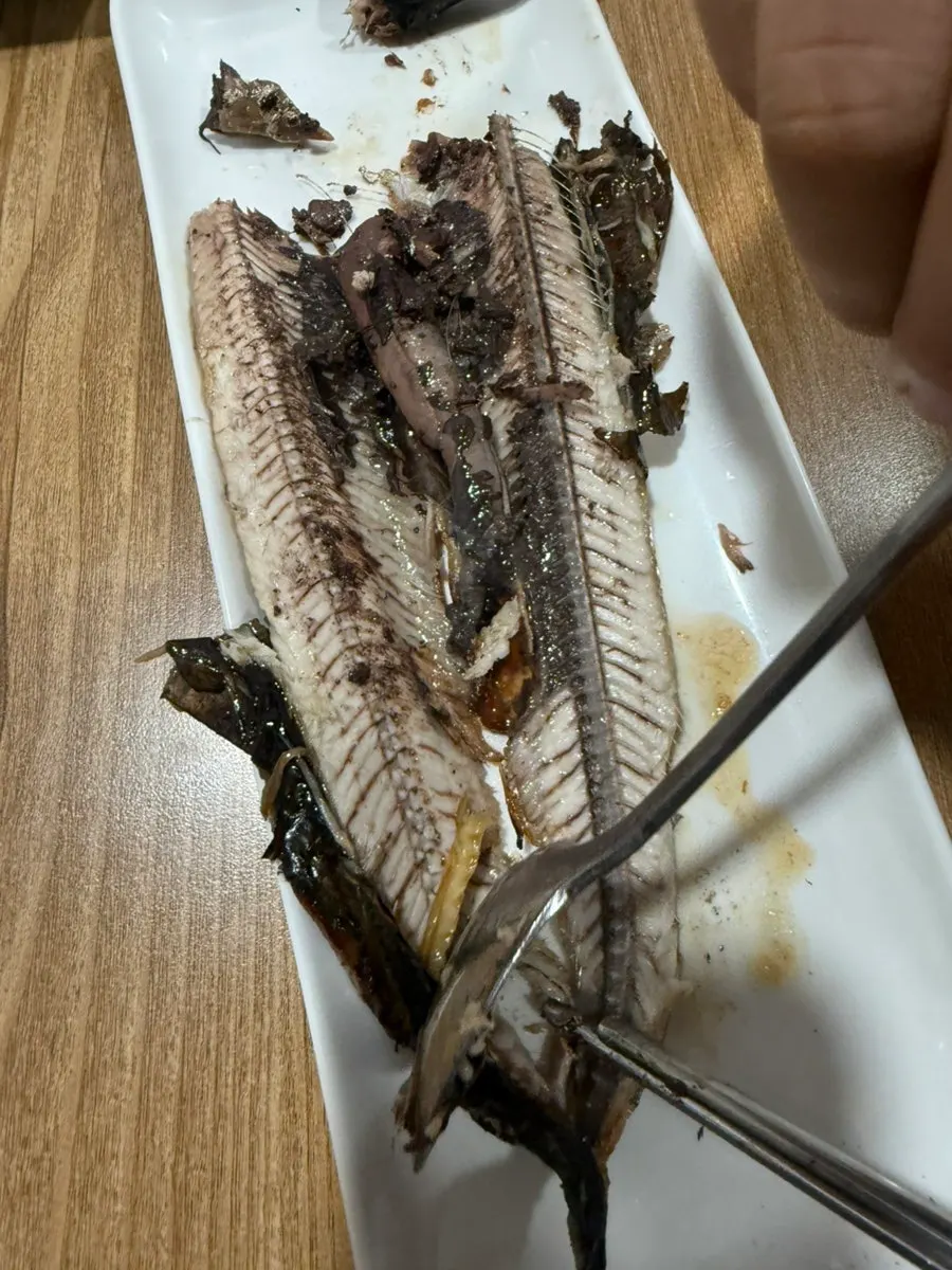 Plate of grilled fish picked down to the bones