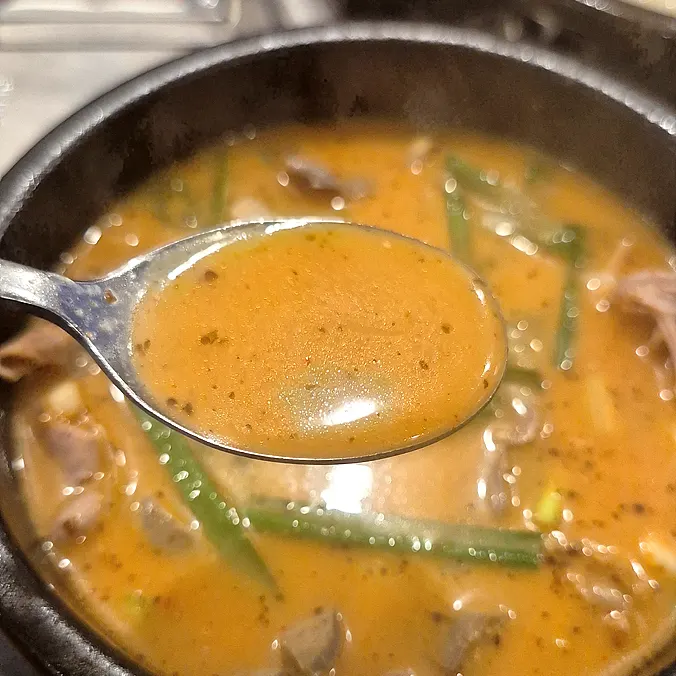 A piece of pork jowl topped with geotjeori