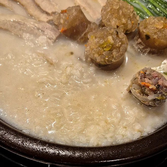A spoonful of spicy intestine gukbap broth