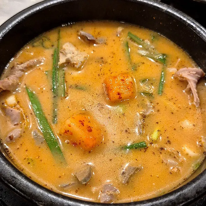 A bowl of rice soaked in the pork jowl broth
