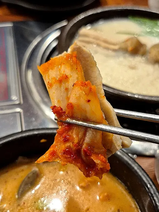 A spoonful of pork-broth rice enjoyed like pork gukbap