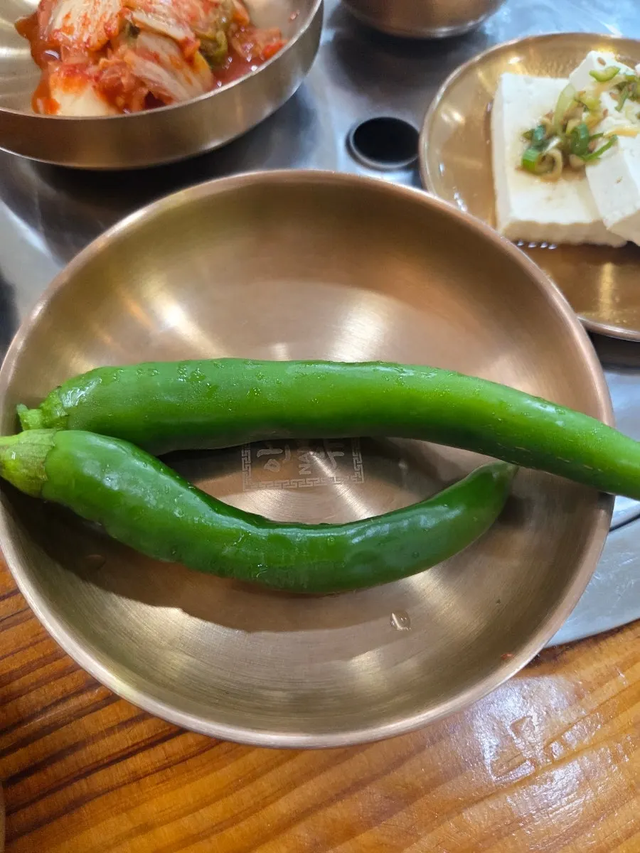 A piece of suyuk with a topping placed on it