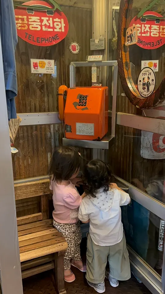 Kid and niece looking at the museum exhibits