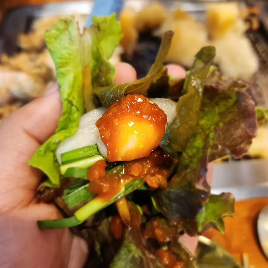 Oyster jeotgal served with a bowl of rice