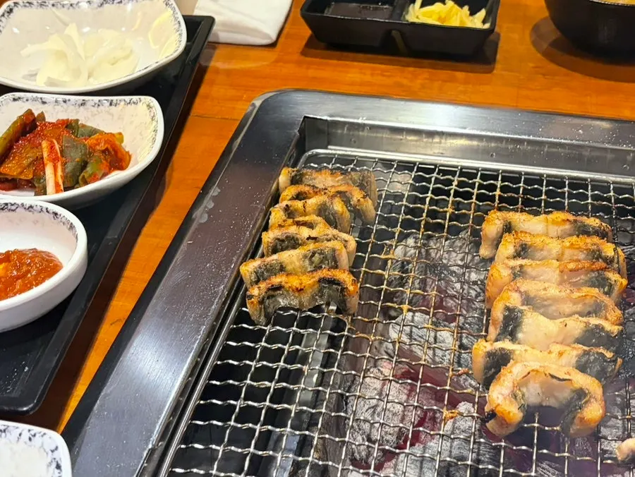Golden-brown grilled eel on the charcoal grill