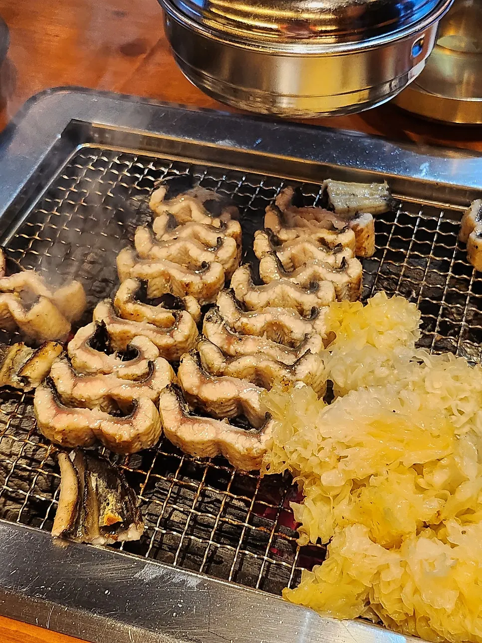 Thick freshwater eel grilling on the grate