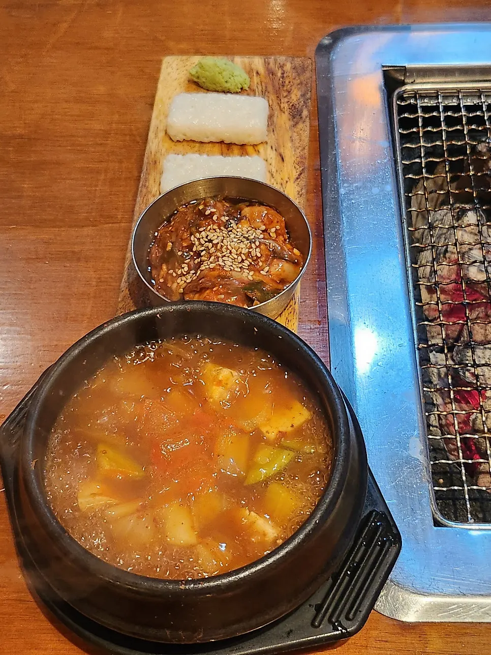 Basic side dish spread of stone-bowl sushi rice, Tongyeong oyster jeotgal, and doenjang jjigae