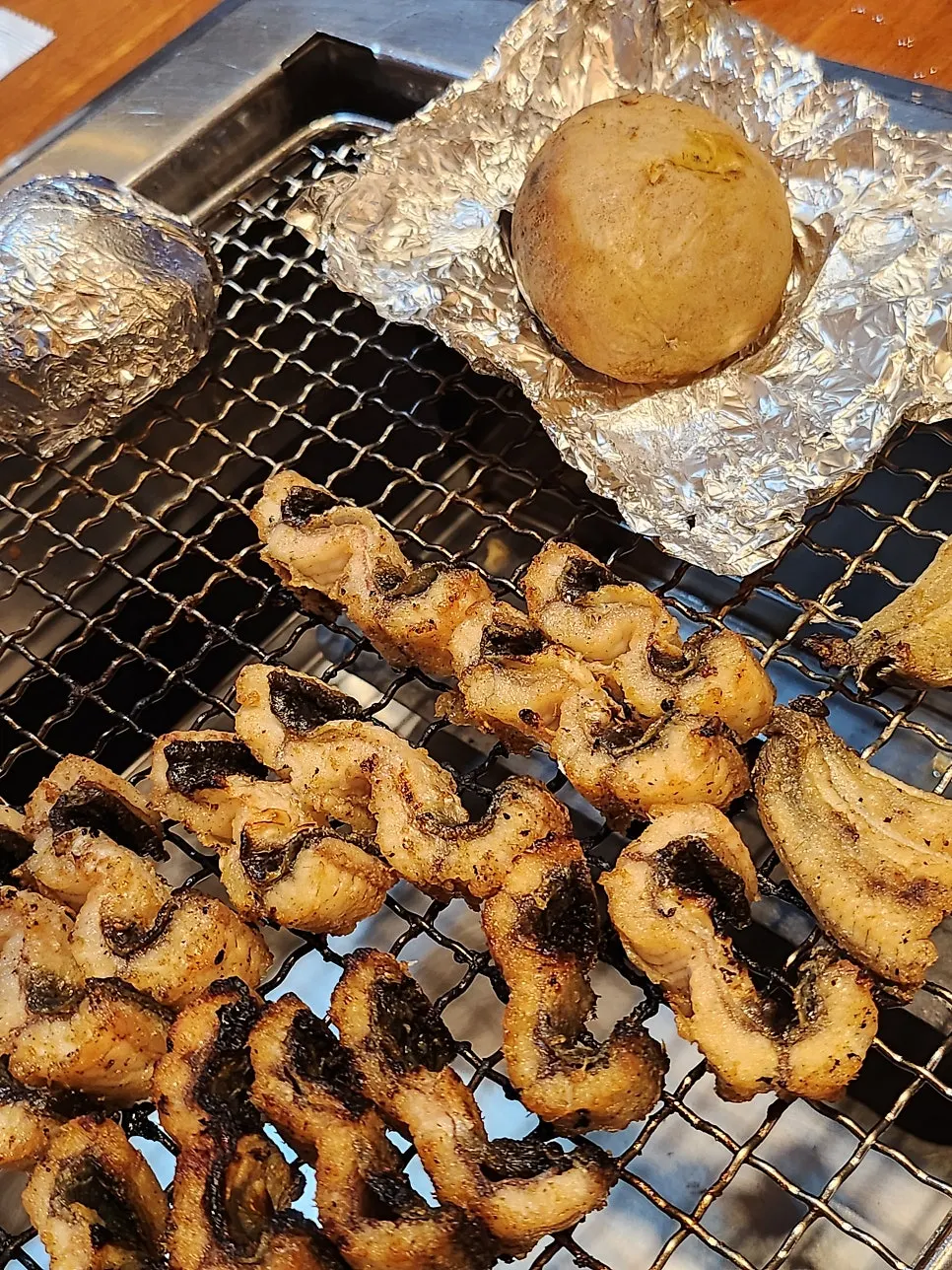 Fluffy grilled small potatoes cooked beside the charcoal