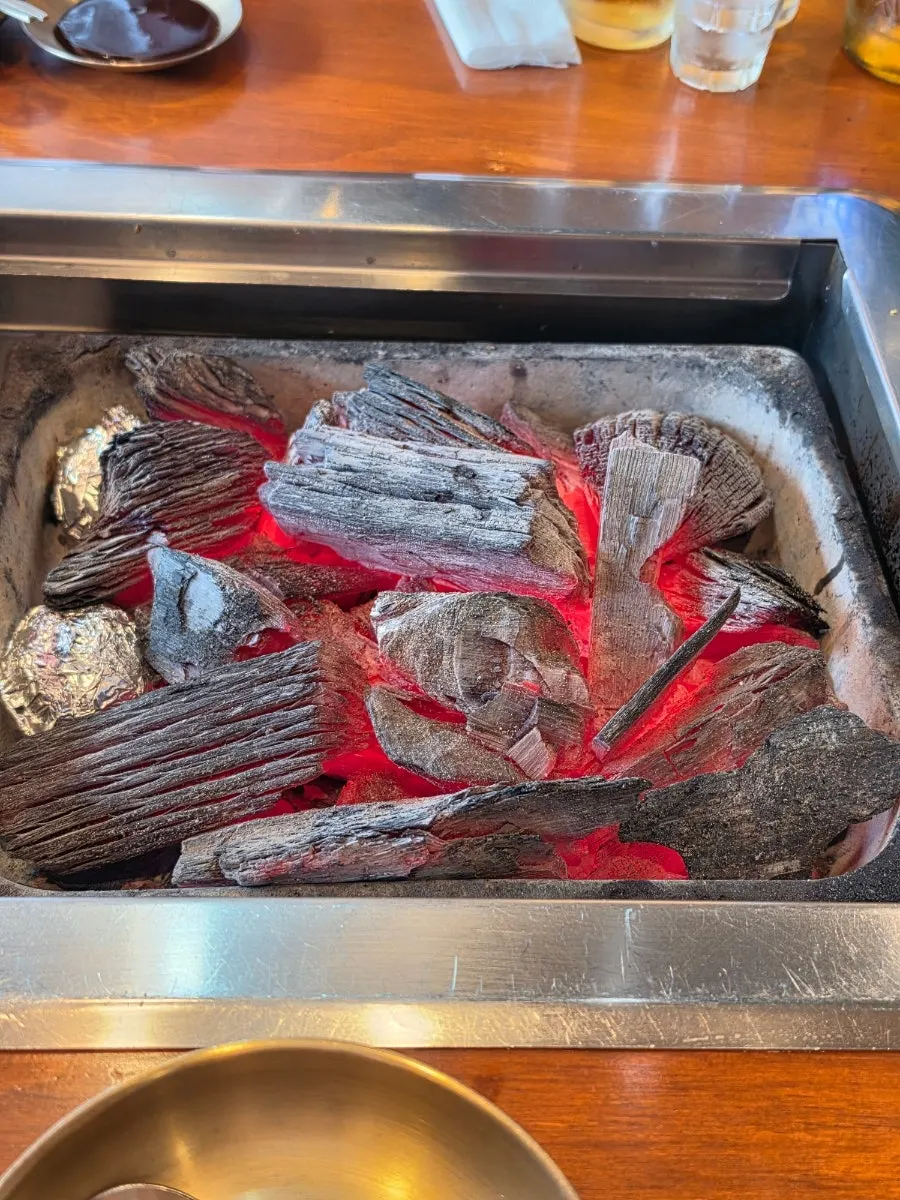 Eel being grilled over domestic charcoal