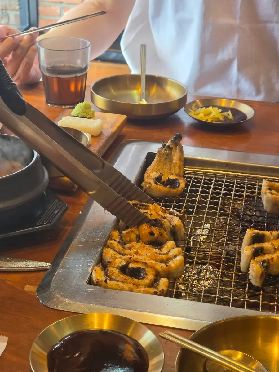 Finished charcoal-grilled eel on the grill plate