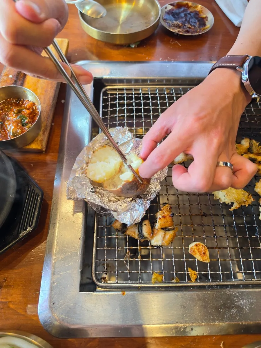 A fluffy, cracked-open roasted potato