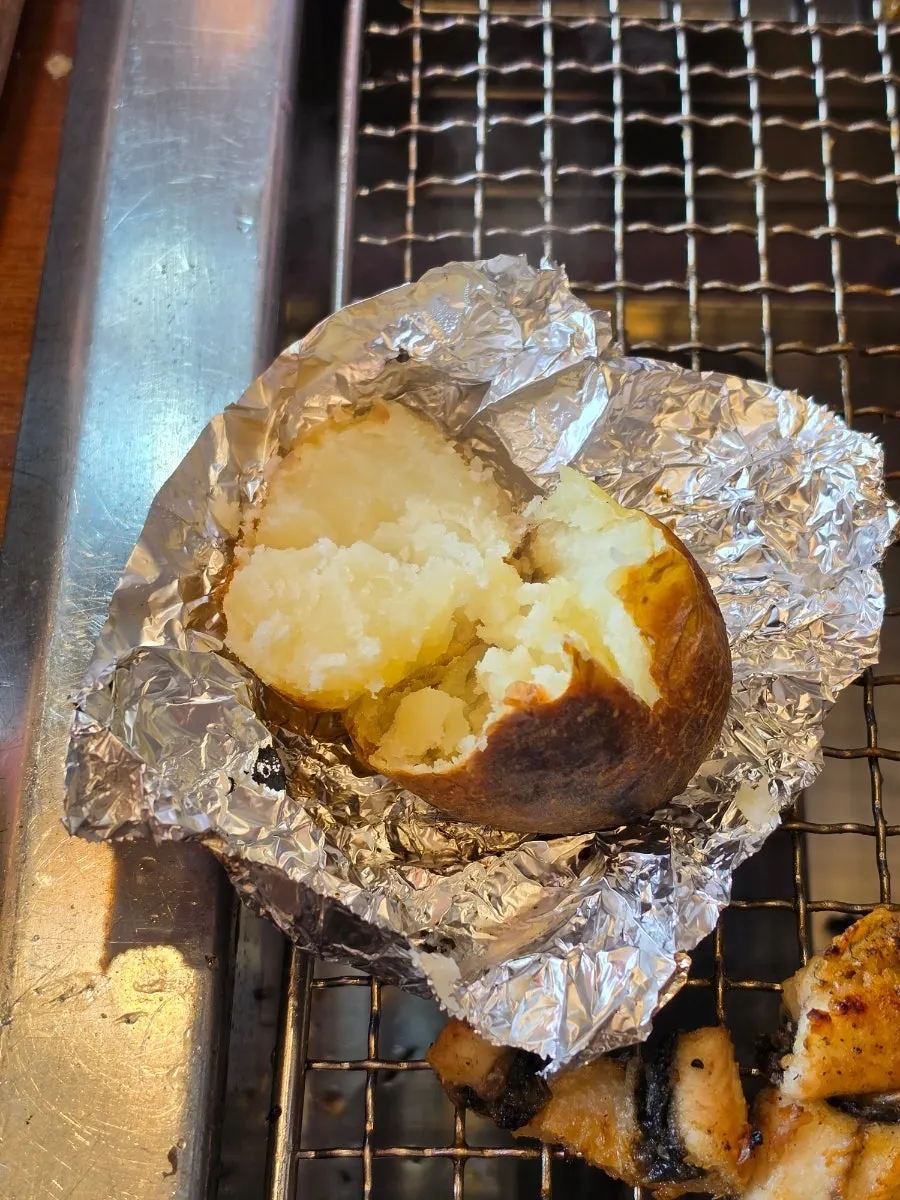 Roasted potato dipped in salt