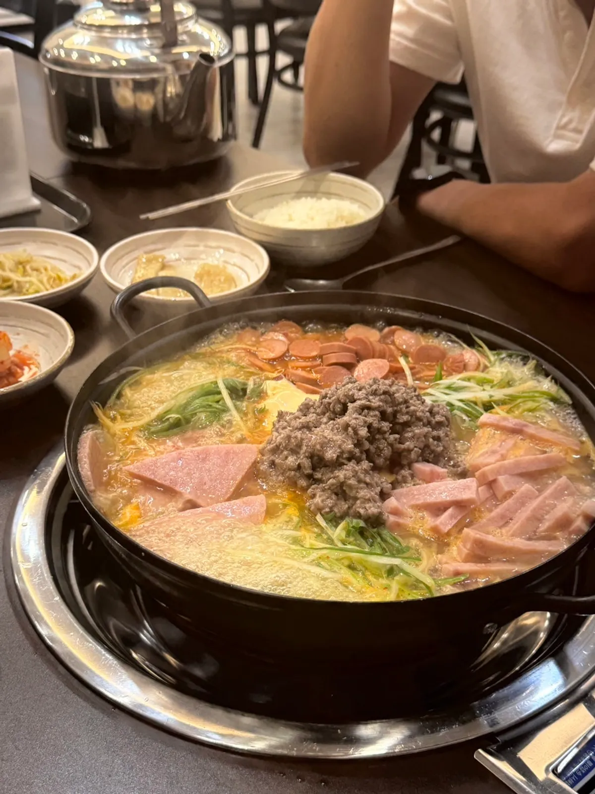 Songtan budae-jjigae packed with ham, sausage, and scallions