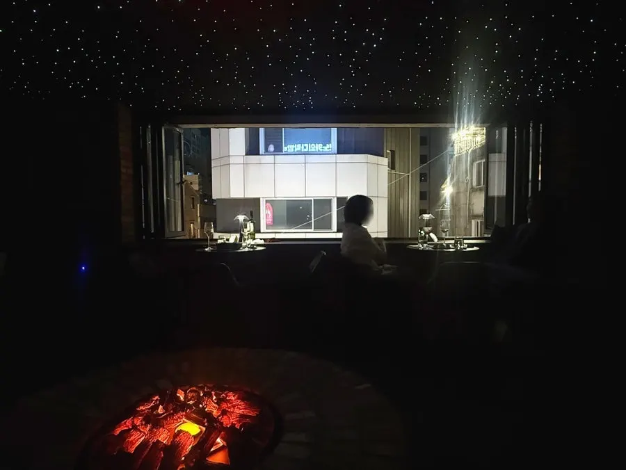 A space at Cherish Mansion lit softly like a living room