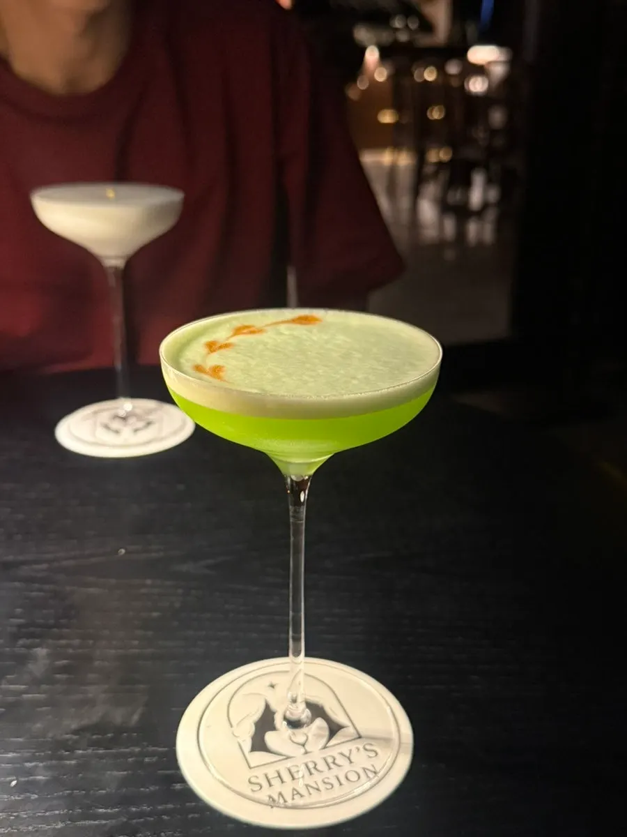 Cherish Mansion's classic Midori Sour cocktail
