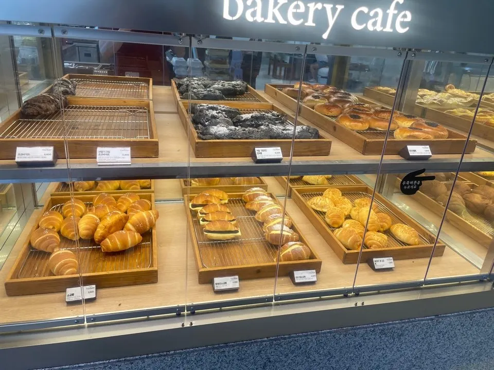 Bakery display case with salt bread and croissants