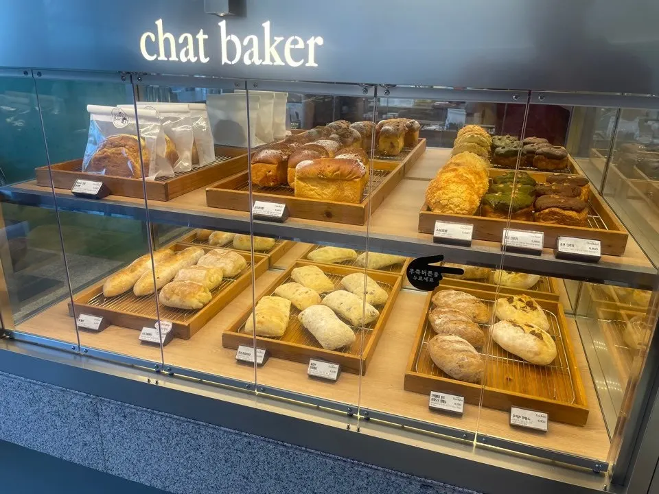 Chat Baker display case with kouign-amann and other breads
