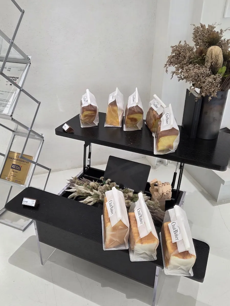 Chat Baker's bakery display case with various breads
