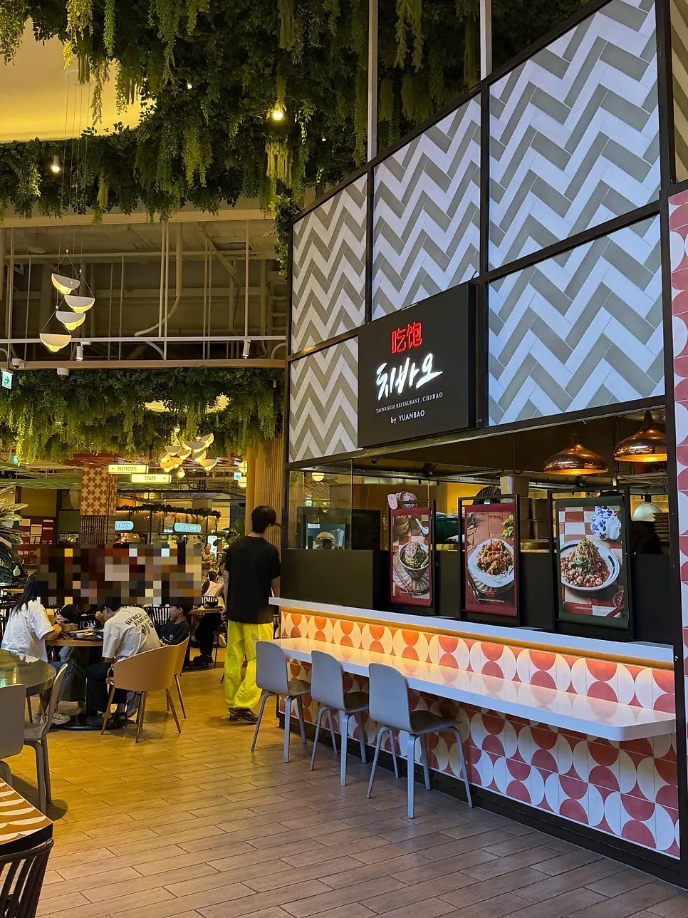 Eatopia table area beside the Chibao storefront