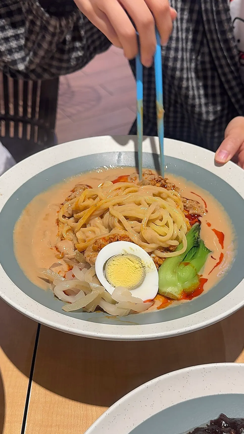 Close-up of the beef tantanmen's peanut sauce broth