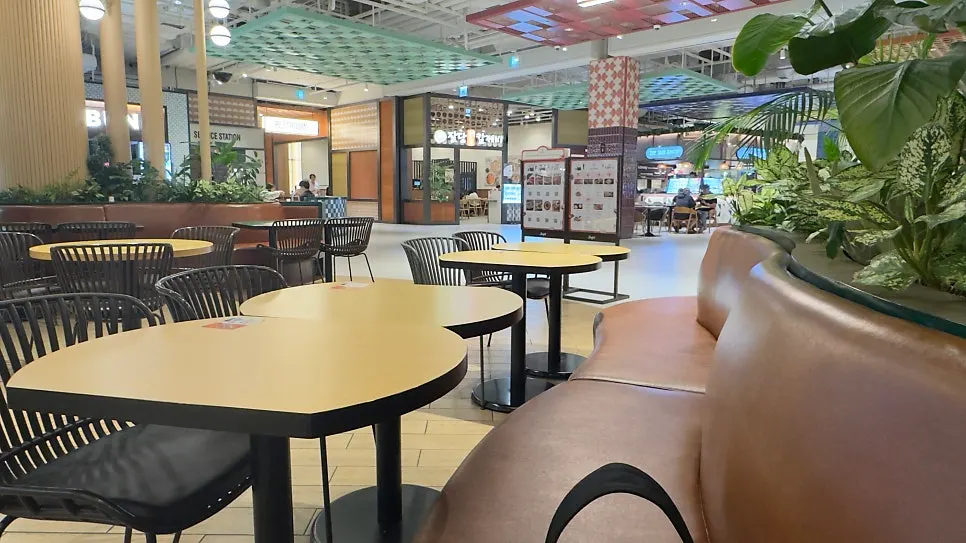 Sofa seating in the food court in front of Chibao