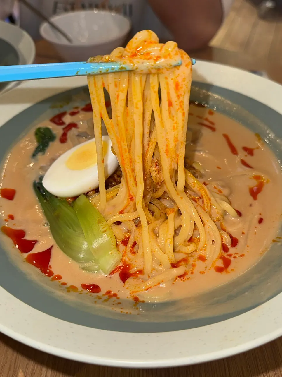 Chibao's tantanmen topped with bok choy and soft-boiled egg