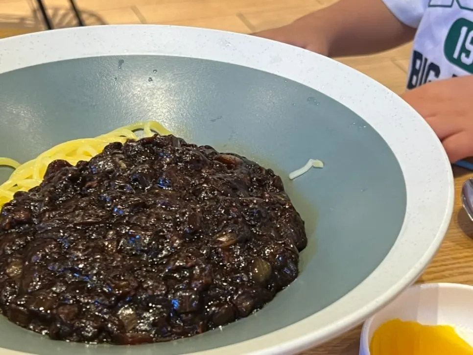 Jjajang sauce fried in oil over noodles